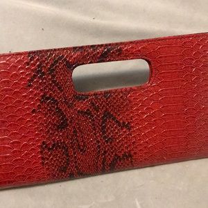 Red snakeskin clutch